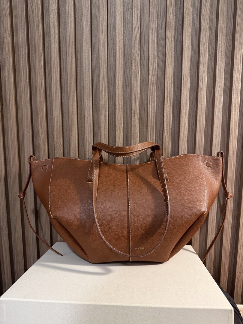Polene Cyme Mini - Textured Cognac (Category: Tote Bags) located in Taguig. Submitted by reneemacaraeg (Listing ID 1467726963, Image 2). Description: - Brand: Polène Cyme Mini Tote - Material: Textured tan leather with contrast white stitching - Features: Structured panels, dual handle lengths, clean interior that fits a laptop easily - Inclusions: Original dust bag and box included - Bought from Paris, ORIGINAL of course. I can even send the pho