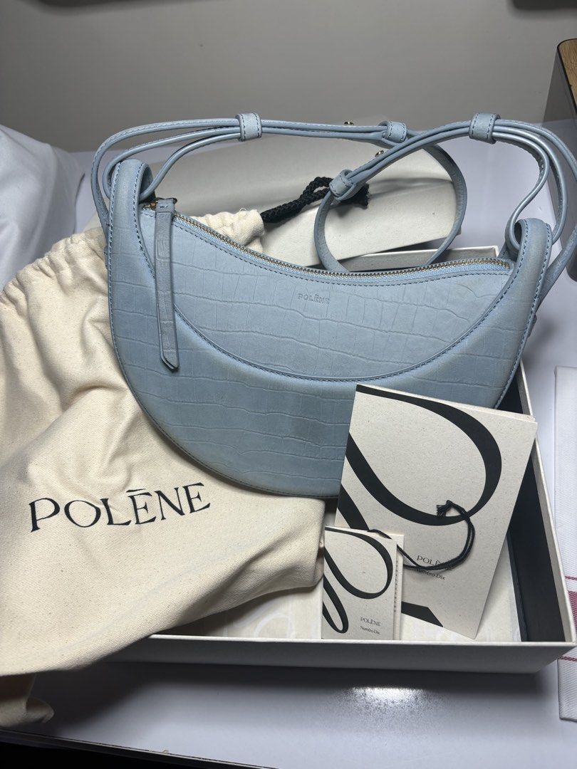 Polène Numéro Dix Croco Embossed Light Blue Bag (Category: Luxury Bags & Wallets) located in Tanauan. Submitted by fiercedolphin_eef7ac (Listing ID 1467669078, Image 1). Description: - Brand: Polène Numéro Dix - Color/Finish: Soft light blue with subtle croc-embossed texture - Hardware: Gold-tone - Closure & Interior: Secure zip closure with suede lining and open slip pocket - Strap: Adjustable double strap system - Condition: Barely used, extrem