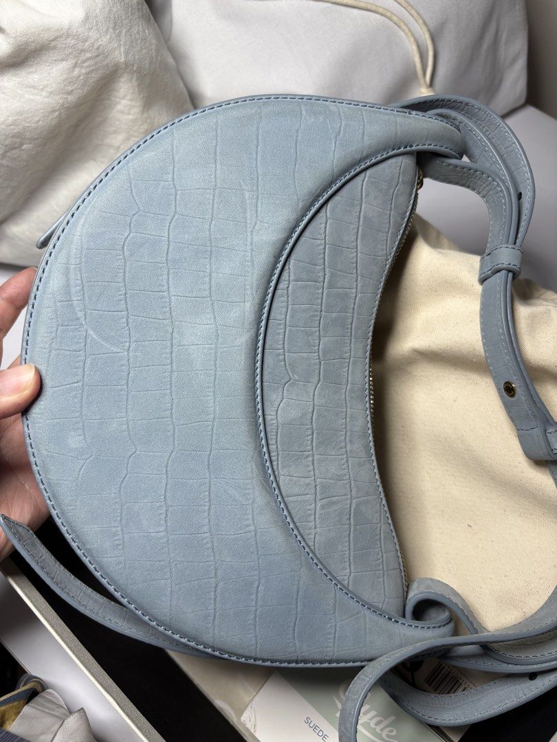 Polène Numéro Dix Croco Embossed Light Blue Bag (Category: Luxury Bags & Wallets) located in Tanauan. Submitted by fiercedolphin_eef7ac (Listing ID 1467669078, Image 3). Description: - Brand: Polène Numéro Dix - Color/Finish: Soft light blue with subtle croc-embossed texture - Hardware: Gold-tone - Closure & Interior: Secure zip closure with suede lining and open slip pocket - Strap: Adjustable double strap system - Condition: Barely used, extrem