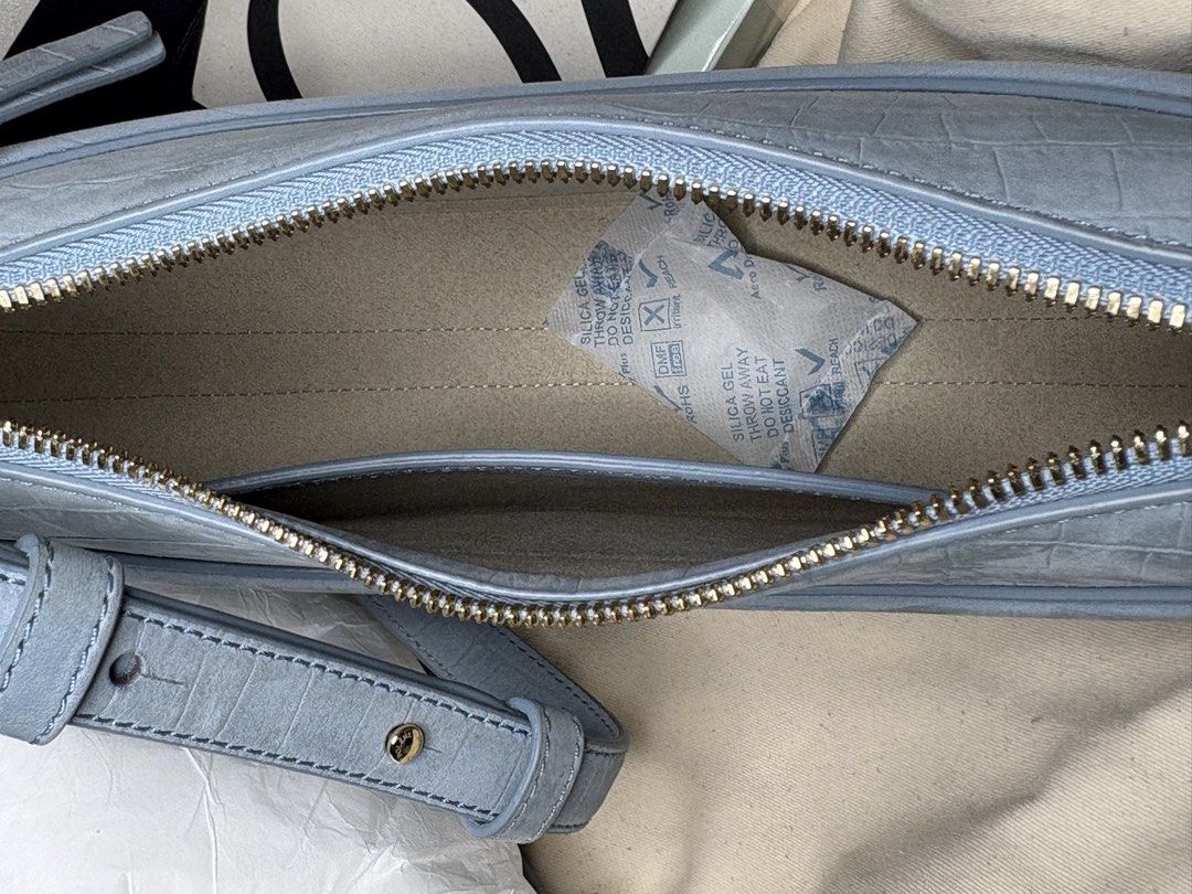 Polène Numéro Dix Croco Embossed Light Blue Bag (Category: Luxury Bags & Wallets) located in Tanauan. Submitted by fiercedolphin_eef7ac (Listing ID 1467669078, Image 2). Description: - Brand: Polène Numéro Dix - Color/Finish: Soft light blue with subtle croc-embossed texture - Hardware: Gold-tone - Closure & Interior: Secure zip closure with suede lining and open slip pocket - Strap: Adjustable double strap system - Condition: Barely used, extrem
