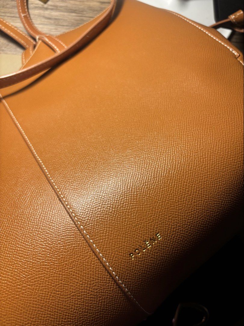 Polène Tan Leather Tote Bag (Category: Luxury Bags & Wallets) located in Dumaguete. Submitted by randompullouts (Listing ID 1467741388, Image 1). Description: Gold-foil embossed logo on the front lower corner. Open top interior with a matching removable base insert. Clean interior lining with generous space for daily essentials..
