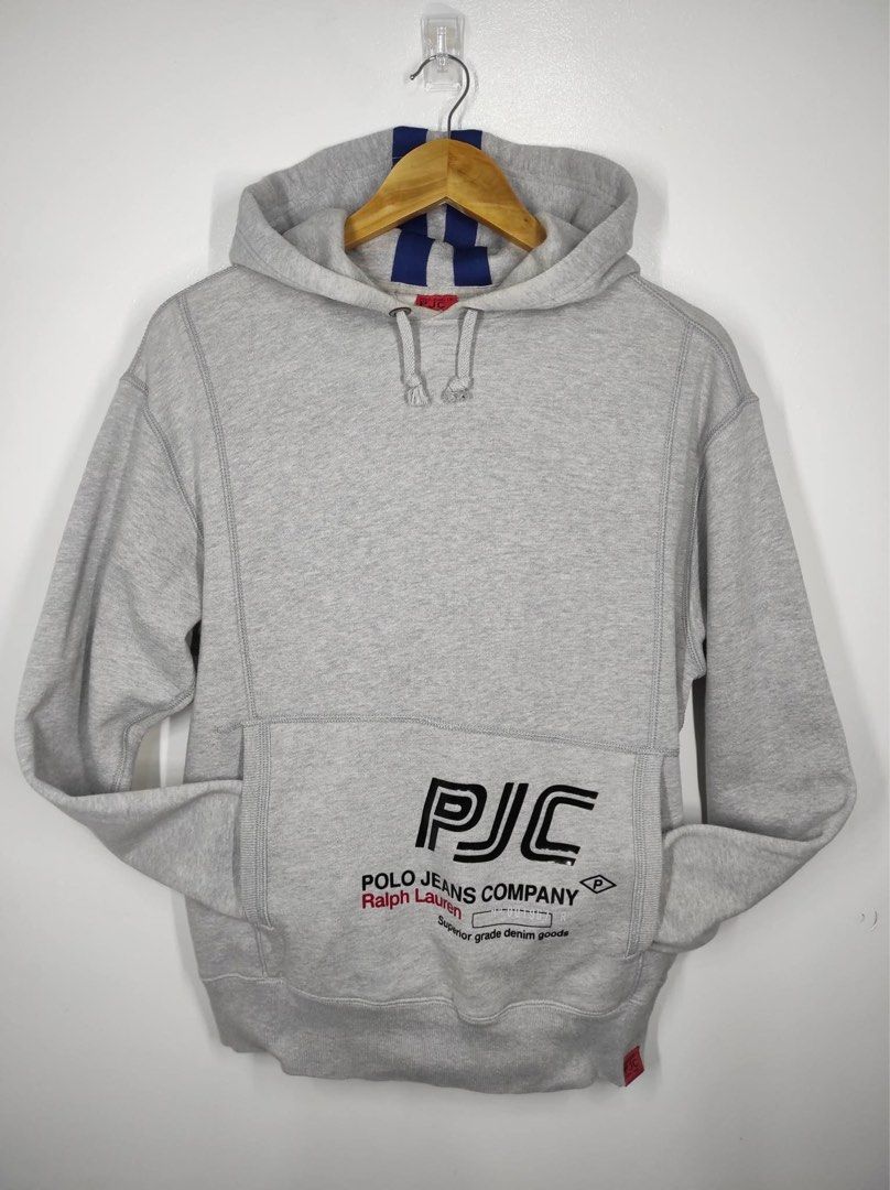 Polo Ralph Lauren Hoodie (Category: Coats, Jackets and Outerwear) located in Bulacan. Submitted by adoseofluxxee (Listing ID 1467615775, Image 1). Description: Vintage Polo Jeans Company (Polo Ralph Lauren) gray pullover hoodie featuring the black "PJC" and "Ralph Lauren" chest logo with blue stripe details on the hood. Size: Small fit Medium.