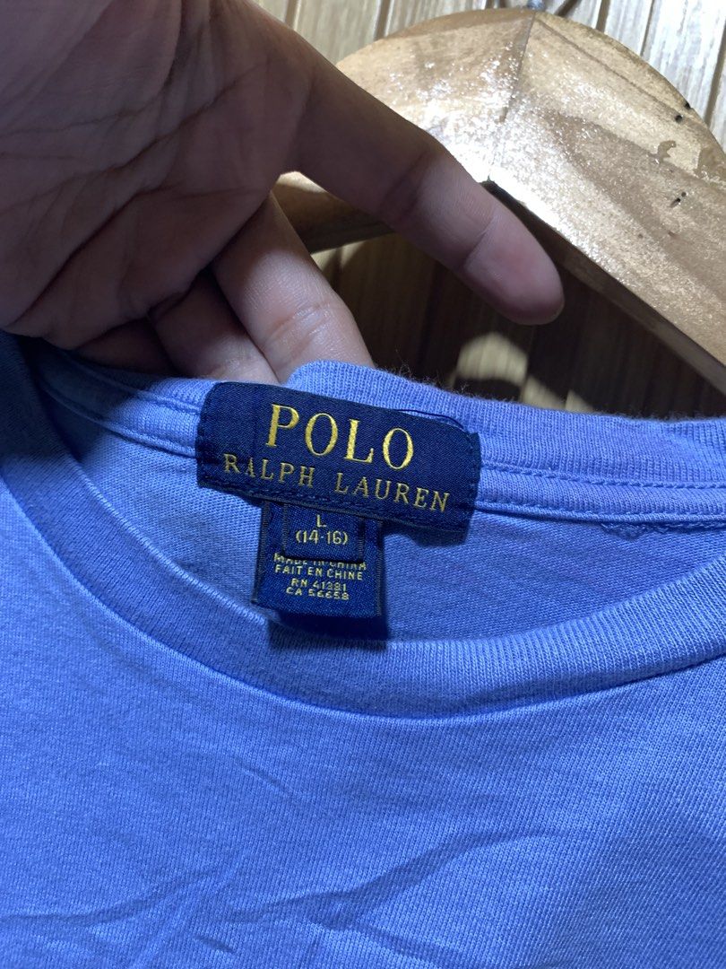 Polo Ralph Lauren Light Blue Tee Size L (Category: Tshirts & Polo Shirts ) located in Kidapawan. Submitted by nicnic1_gem (Listing ID 1467719336, Image 3). Description: - Brand: Polo Ralph Lauren - Color: Light blue with yellow embroidered pony logo - Size: Youth L (14-16) - Material: 100% Cotton - Fit: Classic crew neck with short sleeves - Origin: Made in China - Condition: Excellent, ready to wear.