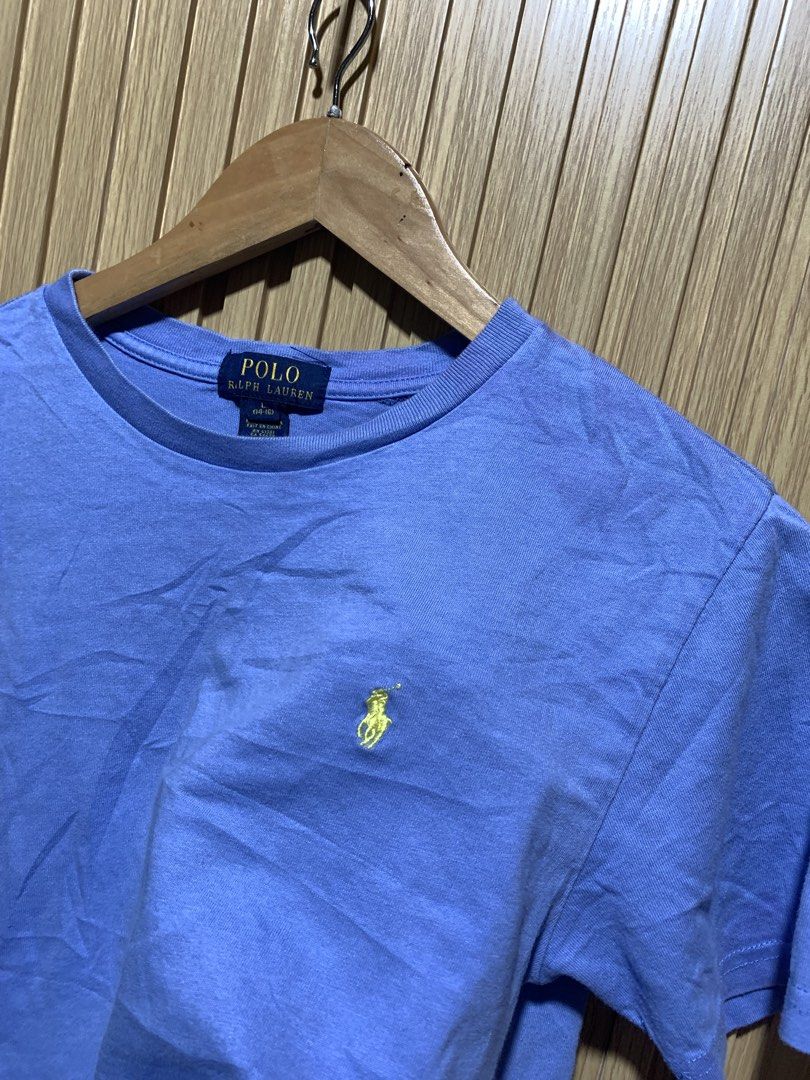 Polo Ralph Lauren Light Blue Tee Size L (Category: Tshirts & Polo Shirts ) located in Kidapawan. Submitted by nicnic1_gem (Listing ID 1467719336, Image 2). Description: - Brand: Polo Ralph Lauren - Color: Light blue with yellow embroidered pony logo - Size: Youth L (14-16) - Material: 100% Cotton - Fit: Classic crew neck with short sleeves - Origin: Made in China - Condition: Excellent, ready to wear.