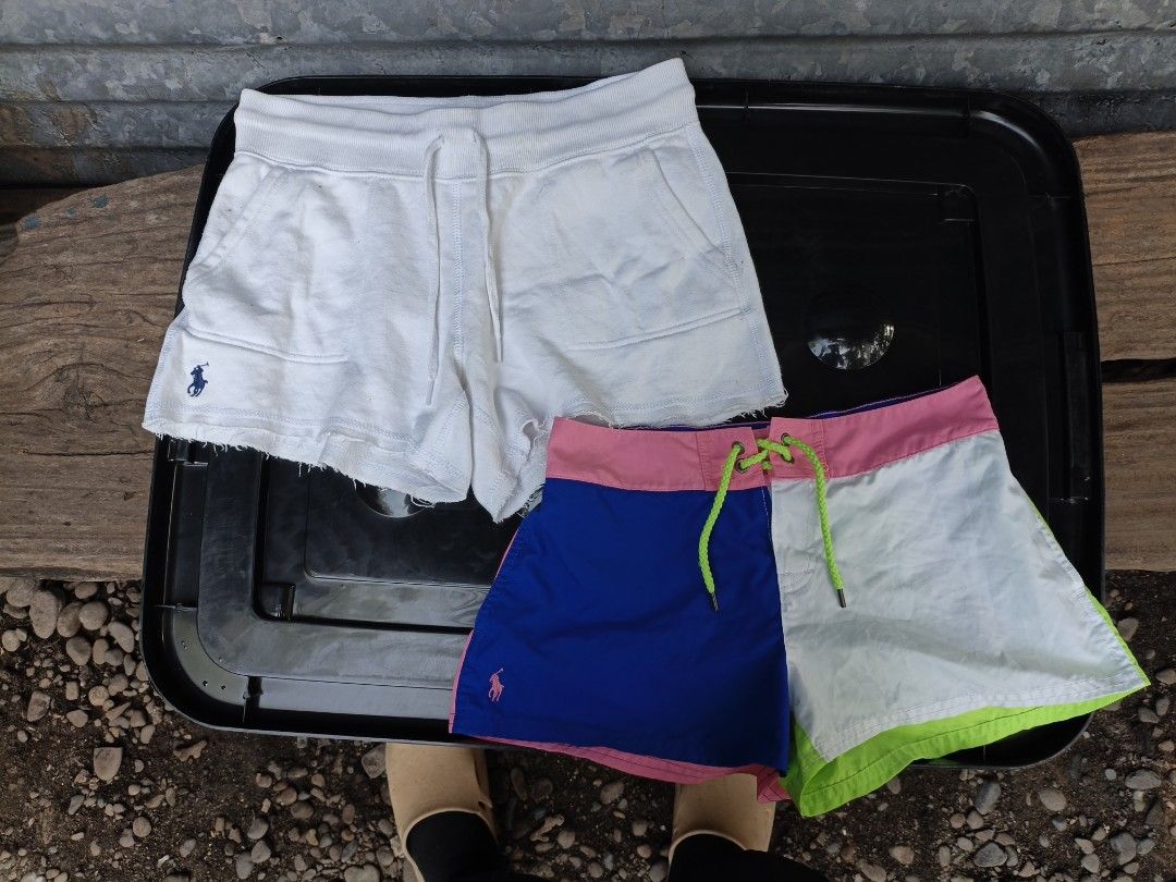 Polo Ralph Lauren Shorts Bundle Size XS (Category: Shorts) located in Maasim. Submitted by ukayganda25 (Listing ID 1467664879, Image 1). Description: - Brand: Polo Ralph Lauren - Size: Extra Small (XS) - Condition: 100% Authentic with inner tags and QR authenticity labels attached - Item 1: White fleece shorts with raw hems and an adjustable drawstring waist - Item 2: Vibrant color-block shorts featuring pink, blue, white, and green panels with a