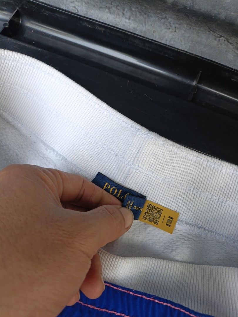 Polo Ralph Lauren Shorts Bundle Size XS (Category: Shorts) located in Maasim. Submitted by ukayganda25 (Listing ID 1467664879, Image 3). Description: - Brand: Polo Ralph Lauren - Size: Extra Small (XS) - Condition: 100% Authentic with inner tags and QR authenticity labels attached - Item 1: White fleece shorts with raw hems and an adjustable drawstring waist - Item 2: Vibrant color-block shorts featuring pink, blue, white, and green panels with a