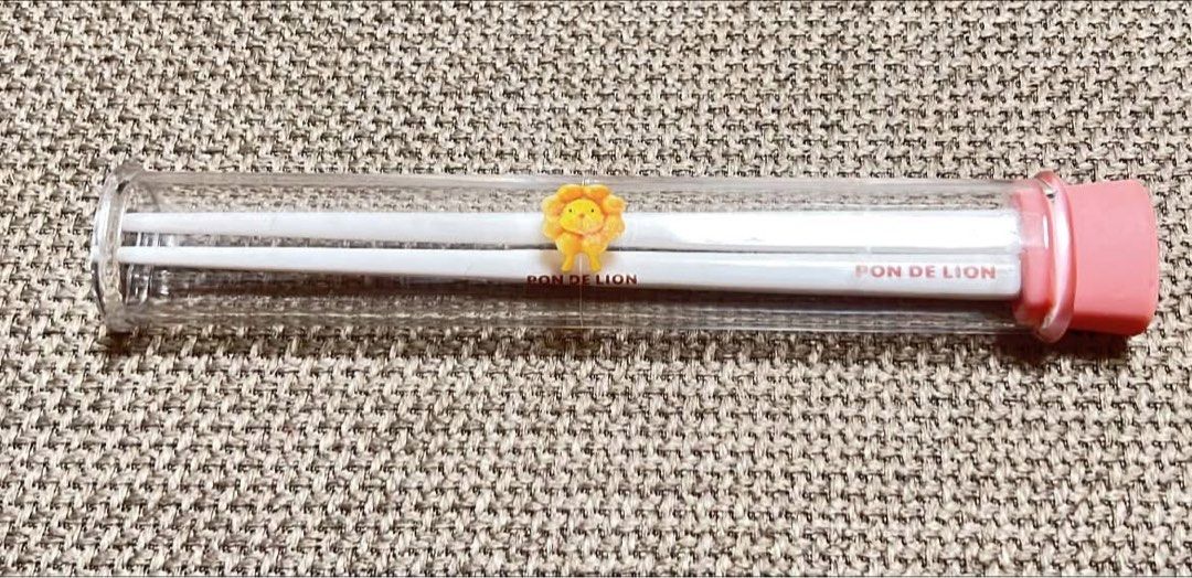 Pon De Lion Chopsticks with Storage Case (Category: Dinnerware & Cutlery) located in Guiguinto. Submitted by ambershelb75728 (Listing ID 1467803750, Image 1). Description: - Official Mister Donut Pon De Lion merchandise - Includes branded white chopsticks and clear cylindrical carrying case - Features cute Pon De Lion mascot design - Comes with a pink base cap to hold chopsticks upright - Great for collectors or everyday lunch use - Brand new and