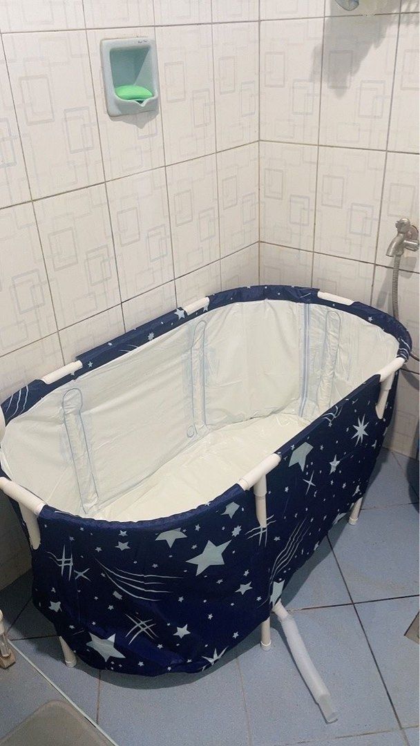 Portable Adult Bathtub (Category: Bathtub & Bath Accessories) located in Marikina City. Submitted by luiliam (Listing ID 1467650403, Image 2). Description: Portable Bathtub Used only once, not totally filled with water only 4” water height inside the tub Don’t need anymore coz floor sink already fixed Php 700 (fixed price), bought it almost Php 900 Good as new - Dimensions: 120cm (L) x 50cm (W) x 55cm (H) - Complete set includes connecting rods a