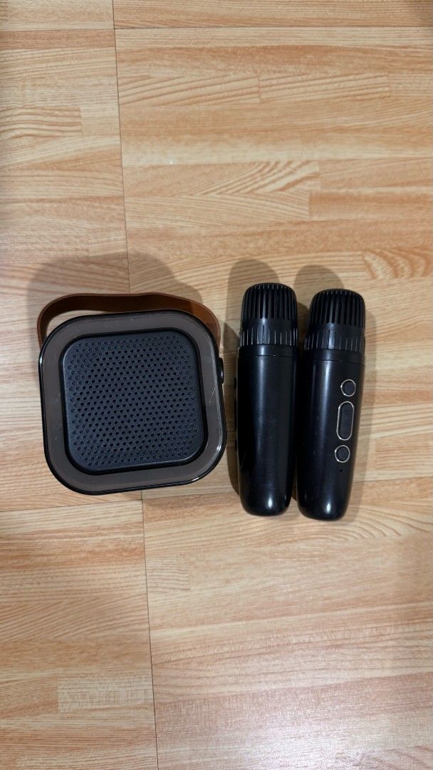 Portable Karaoke Bluetooth Speaker with Two Wireless Microphones (Category: Soundbars, Speakers & Amplifiers) located in Manila. Submitted by queenofthesea0202 (Listing ID 1467644753, Image 2). Description: - Complete set: Portable karaoke speaker and 2 wireless black microphones - Vibrant RGB lighting and stylish leather carrying strap - Wireless connectivity for phones and tablets - Compact and lightweight for parties, gatherings, and home use 