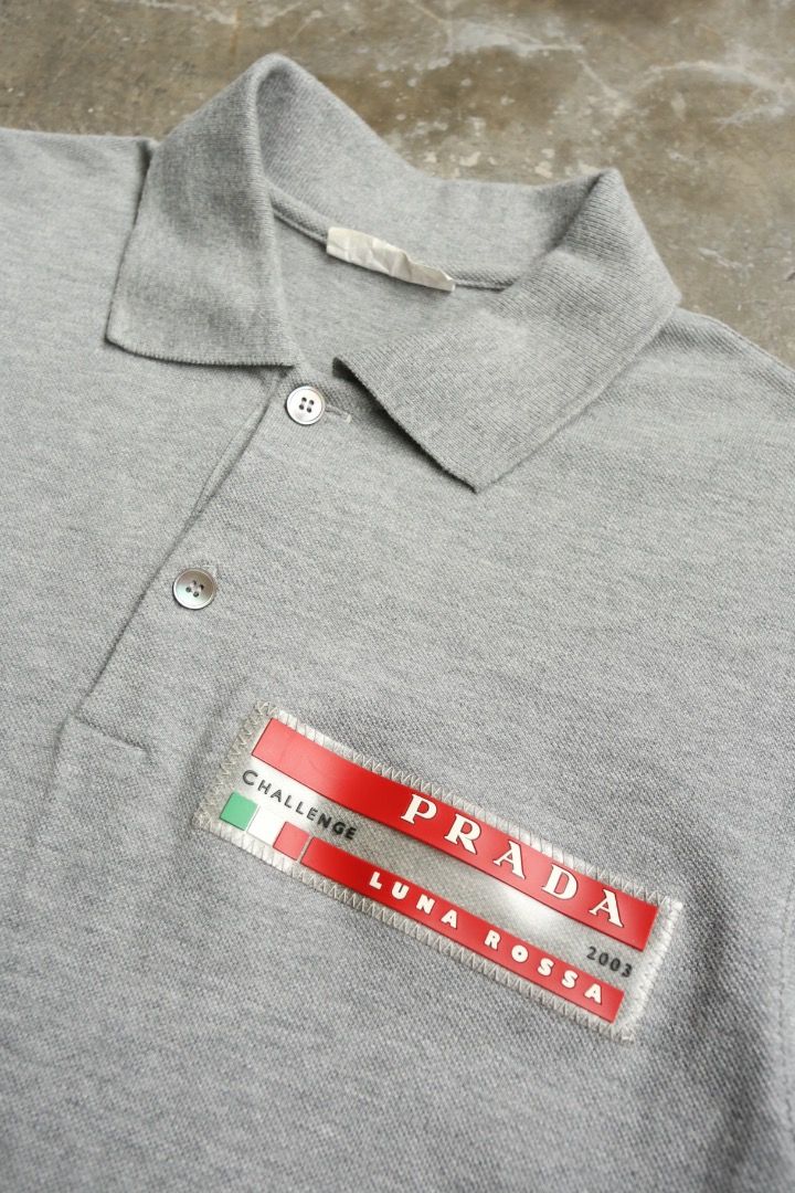 Prada - 2003 Luna Rossa Challenge Polo (Category: Tshirts & Polo Shirts ) located in Manila. Submitted by graymatter_ (Listing ID 1467644625, Image 3). Description: Prada - 2003 Luna Rossa Challenge Polo *Team Member Exclusive Tagged Size: (fits L) Flaws: Cut Size Tag Condition: 100% Cotton Made in: China Dimensions Length: 28.5 Width: 21 Shoulder: 17 Sleeve: 9.