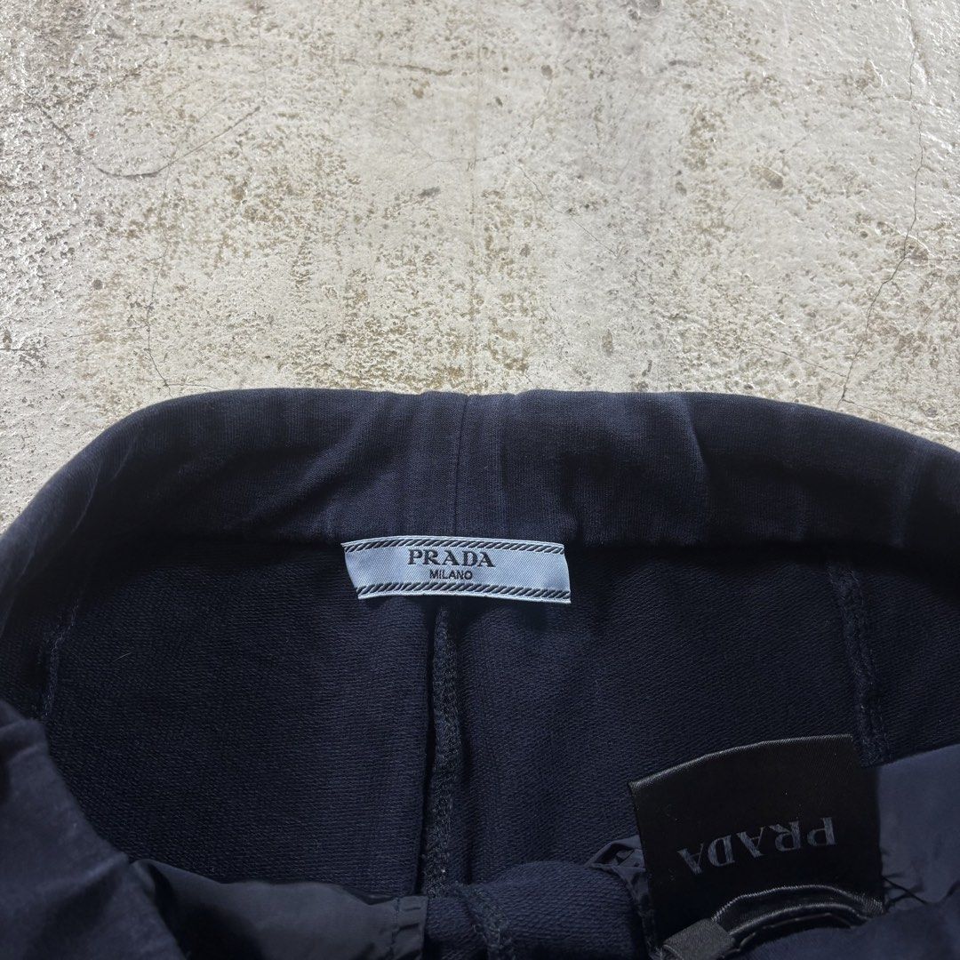 Prada Navy Blue Sweatpants Size XS (Category: Luxury Apparel) located in Caloocan City. Submitted by thrift.crcl (Listing ID 1467777758, Image 3). Description: - Brand: Prada - Item: Cotton Sweatpants - Color: Dark Navy Blue - Size: XS - Features: Drawstring waist, signature red Prada logo tag near bottom hem - Condition: Clean interior tags and branding details clearly shown - Authentic and comfortable for everyday wear Size 28-30 Length 39 .