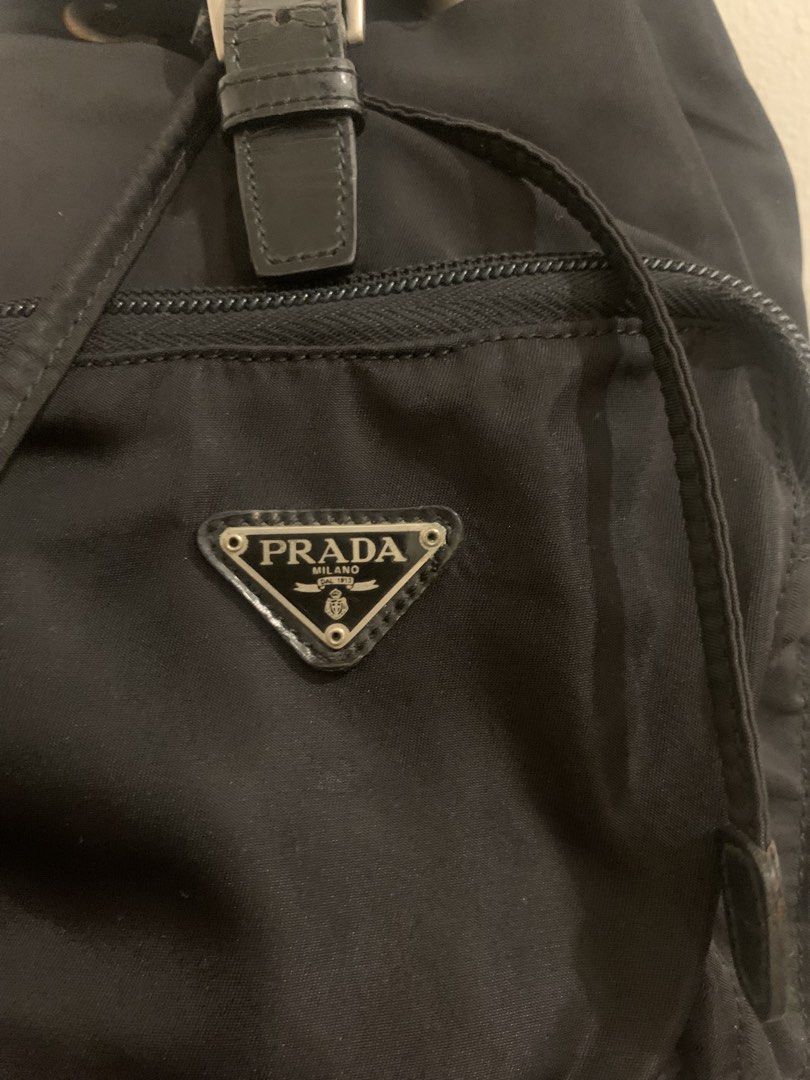 PRADA nylon black mini backpack (Category: Backpacks) located in Mandaluyong City. Submitted by confessionsofashopaholic64 (Listing ID 1467754452, Image 3). Description: authentic, vintage no white tag na, bulldog zip small pero madami malalagay deep black pa, maganda sa personal (pics cant justify since nylon ung material) normal signs of use. may dirt sa ilalim pero di halata pag gamit. hardwares need polish no inclusion.