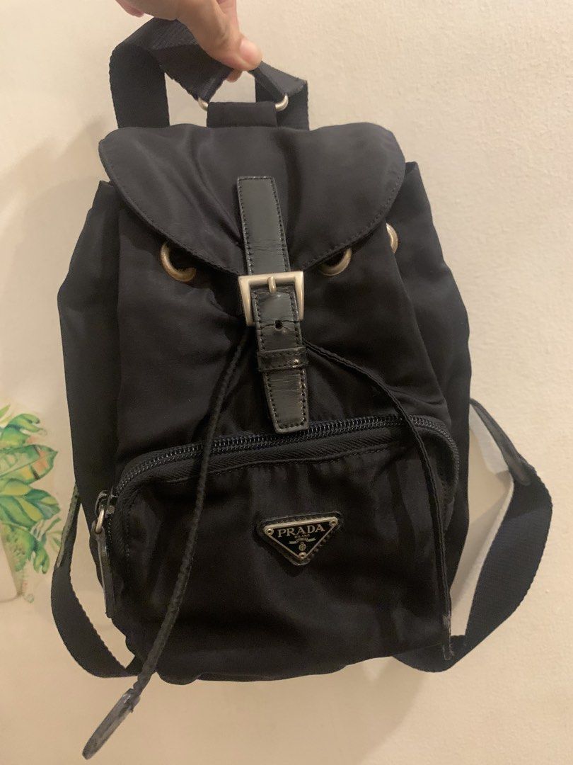 PRADA nylon black mini backpack (Category: Backpacks) located in Mandaluyong City. Submitted by confessionsofashopaholic64 (Listing ID 1467754452, Image 1). Description: authentic, vintage no white tag na, bulldog zip small pero madami malalagay deep black pa, maganda sa personal (pics cant justify since nylon ung material) normal signs of use. may dirt sa ilalim pero di halata pag gamit. hardwares need polish no inclusion.