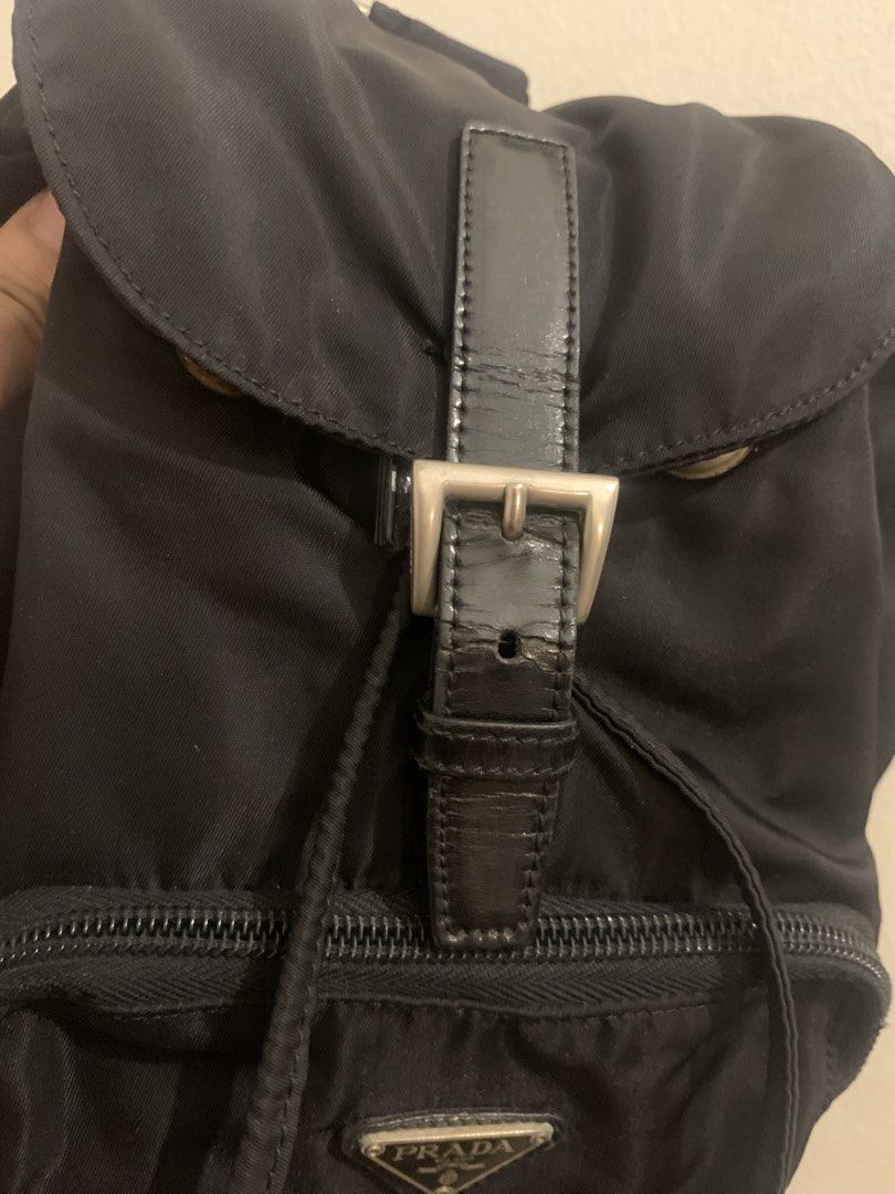 PRADA nylon black mini backpack (Category: Backpacks) located in Mandaluyong City. Submitted by confessionsofashopaholic64 (Listing ID 1467754452, Image 2). Description: authentic, vintage no white tag na, bulldog zip small pero madami malalagay deep black pa, maganda sa personal (pics cant justify since nylon ung material) normal signs of use. may dirt sa ilalim pero di halata pag gamit. hardwares need polish no inclusion.