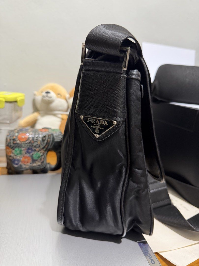 PRADA Nylon Tessuto Sling Bag Black coach balenciaga (Category: Luxury Bags & Wallets) located in Magsaysay. Submitted by goodiesthift (Listing ID 1467637521, Image 3). Description: Selling Prada Saffiano Trimmed Tessuto Double Buckle Messenger Bag crossbody color black bag Kasya Ipad Pro 12 inches. black color very good condition Depth: 5 cm (1.96 in) Width: 32cm (13.in) Height: 23 cm (9.02 in) Strap: 62.5 cm (24.6 in Negotiable .