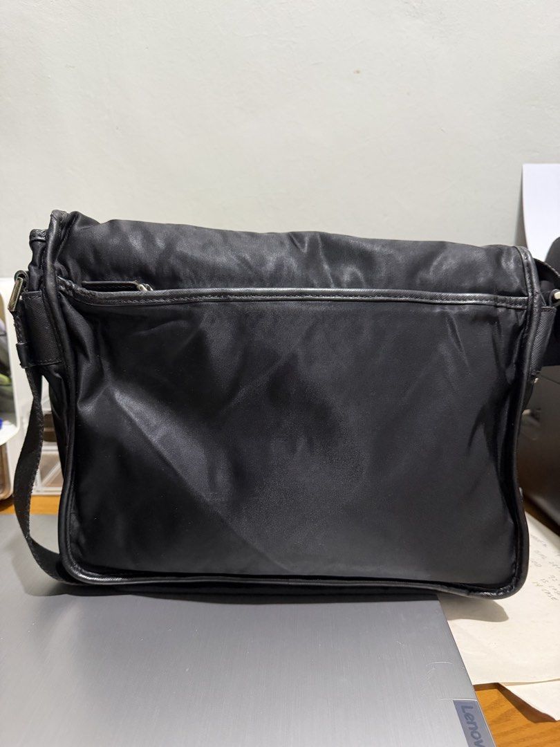 PRADA Nylon Tessuto Sling Bag Black coach balenciaga (Category: Luxury Bags & Wallets) located in Magsaysay. Submitted by goodiesthift (Listing ID 1467637521, Image 2). Description: Selling Prada Saffiano Trimmed Tessuto Double Buckle Messenger Bag crossbody color black bag Kasya Ipad Pro 12 inches. black color very good condition Depth: 5 cm (1.96 in) Width: 32cm (13.in) Height: 23 cm (9.02 in) Strap: 62.5 cm (24.6 in Negotiable .