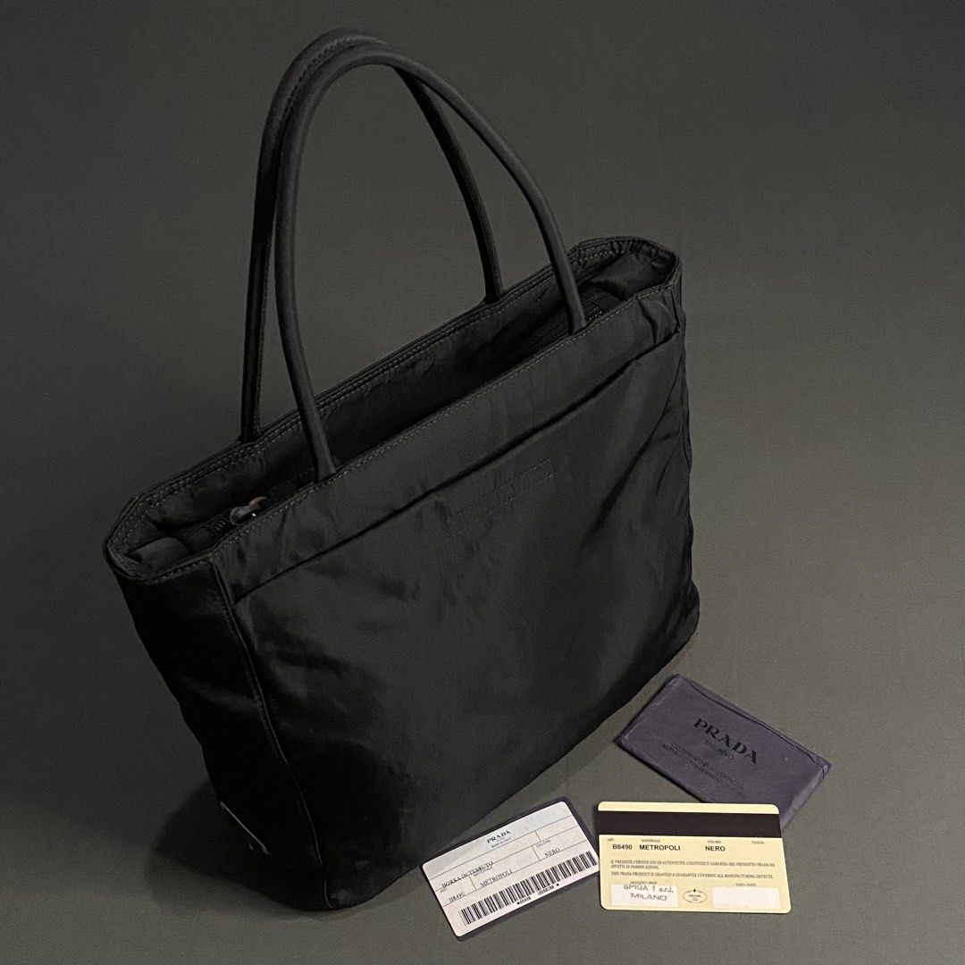 Prada Tessuto Metropoli Nylon Tote Bag (Category: Tote Bags) located in Cavite. Submitted by lit_loots (Listing ID 1467788761, Image 1). Description: Like new condition With authenticity card Colore rate 10/10 Issue: Stitching inside.