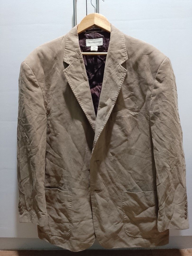Pronto Uomo Beige Blazer Jacket XXL (Category: Coats, Jackets and Outerwear) located in Manila. Submitted by aggroreggae_24 (Listing ID 1467682976, Image 1). Description: - Brand: Pronto Uomo - Color: Beige with brown inner lining - Size: XXL - Style: Classic, ideal for formal or smart-casual wear - Features: Two-button front closure, front patch pockets, chest pocket, and button cuff details - Condition: Needs ironing.