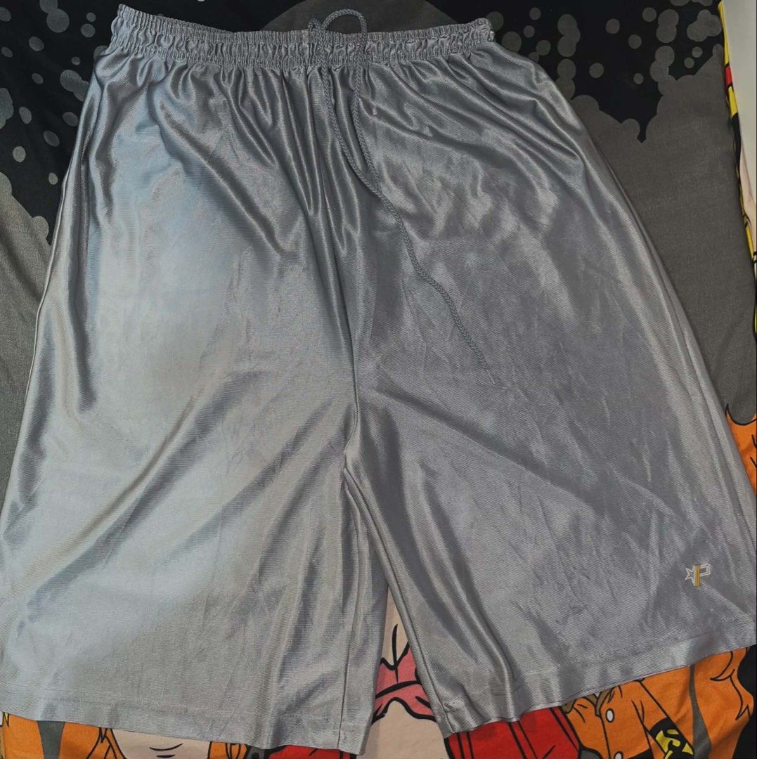 Proz Wear Silver (Category: Shorts) located in Manila. Submitted by xlyssaa_20 (Listing ID 1467795735, Image 1). Description: - Brand: Proz Wear - Size: XL - Color: Silver - Material: Lightweight, shiny polyester - Features: Adjustable drawstring waistband and embroidered logo on the left leg hem.