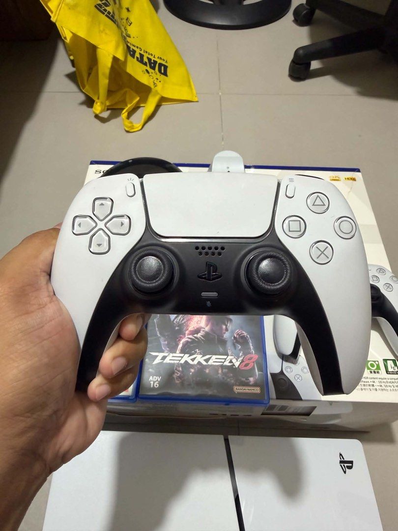 PS5 SLIM 1TB (Complete) (Category: PlayStation) located in Caloocan City. Submitted by chapter_01 (Listing ID 1467673863, Image 3). Description: PS5 SLIM 1TB FOR SALE - Excellent condition, experienced no problem since bought from DataBlitz. - Case was never open. - HDMI & Power plug - 2 Original Dualsense Controller - Dobe Vertical Console stand - Dobe DS controller charging dock - 4 physical games 1 digital - Tekken 8, NBA 2k25, Resident Evil 4
