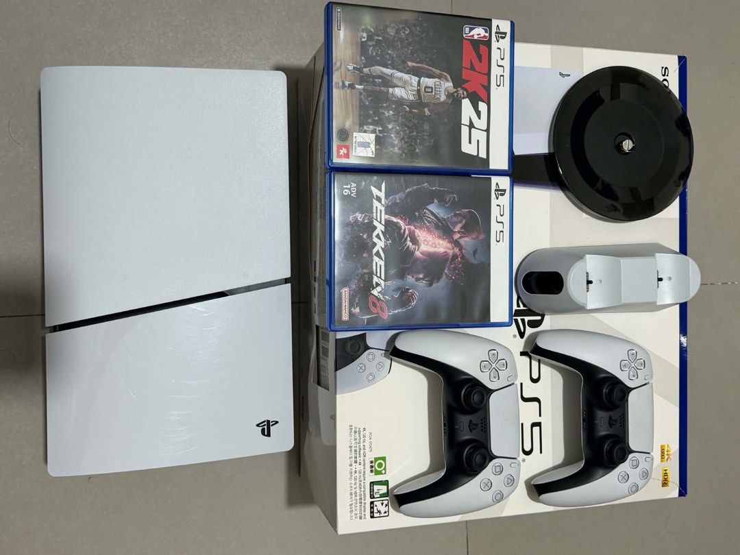 PS5 SLIM 1TB (Complete) (Category: PlayStation) located in Caloocan City. Submitted by chapter_01 (Listing ID 1467673863, Image 2). Description: PS5 SLIM 1TB FOR SALE - Excellent condition, experienced no problem since bought from DataBlitz. - Case was never open. - HDMI & Power plug - 2 Original Dualsense Controller - Dobe Vertical Console stand - Dobe DS controller charging dock - 4 physical games 1 digital - Tekken 8, NBA 2k25, Resident Evil 4