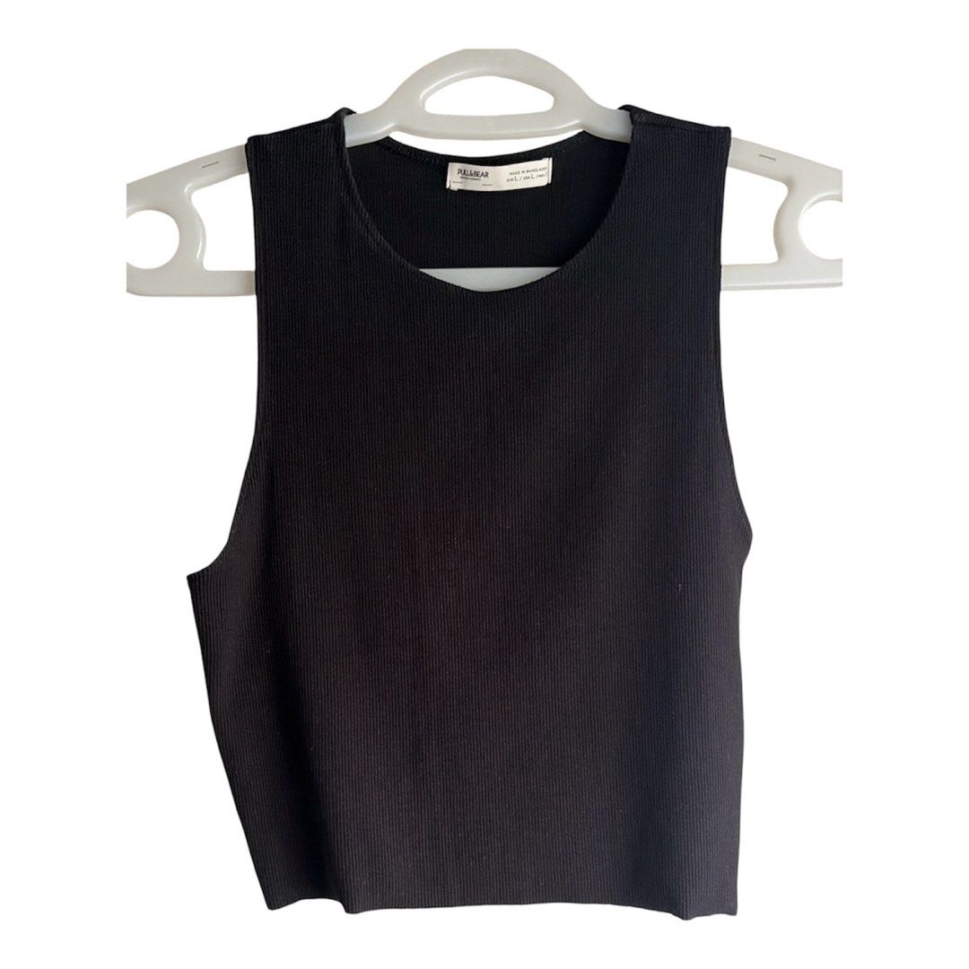 Pull & Bear Black Ribbed Tank Top 🌸 (Category: Sleeveless) located in Manila. Submitted by ceethingsout (Listing ID 1467607119, Image 1). Description: • Brand: Pull & Bear • Color: Black • Used only once. Tagged as Large, but the sizing runs small. Fits approximately XS–Medium (estimated). I’m usually a size Small, and it fits me perfectly. • Style: Crew neck, sleeveless, cropped length •Fabric: Stretchy, body-hugging ribbed material •bought for