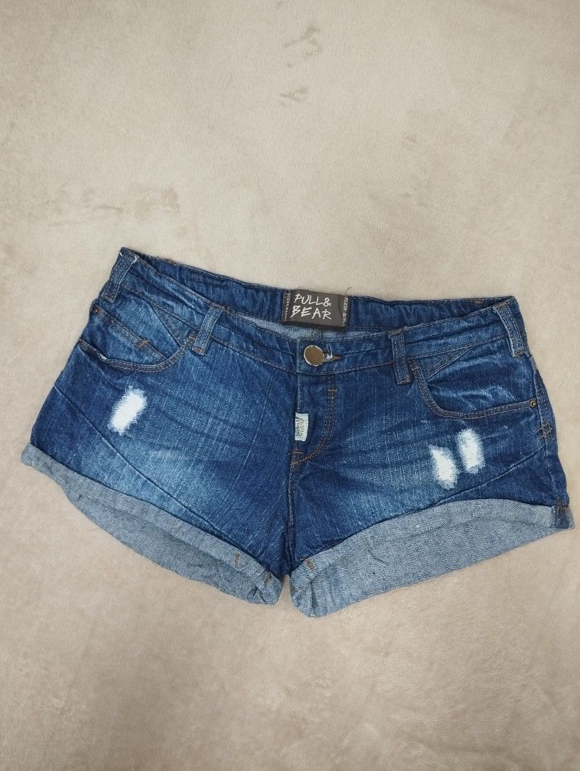 Pull & Bear Denim Shorts Distressed Rolled Cuff Size 30 (Category: Shorts) located in Dagupan City. Submitted by nartleb_naan (Listing ID 1467651723, Image 1). Description: - Brand: Pull & Bear - Size: 38 - Wash: Dark wash denim - Details: Distressed front and back pockets with rolled cuffs - Fit: Button closure with belt loops - Material: Comfortable cotton blend - Condition: Great casual piece for warmer weather.