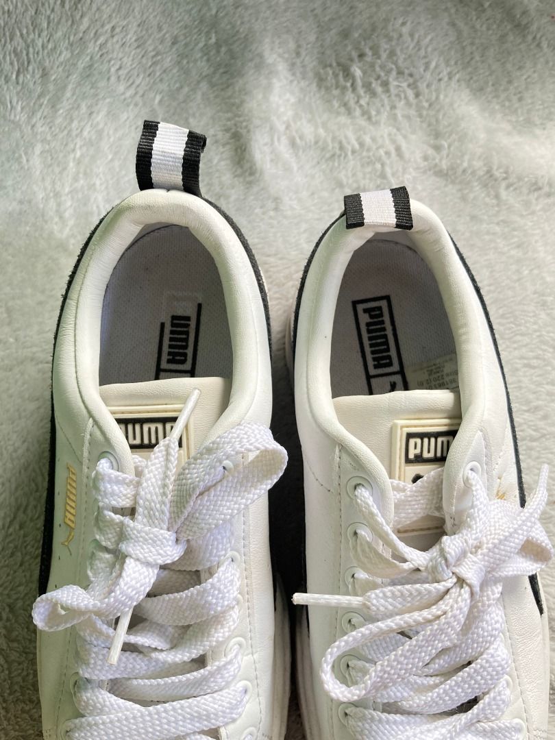 Puma Mayze Platform White Black Sneakers (Category: Sneakers) located in Rizal. Submitted by sheeraay (Listing ID 1467707945, Image 2). Description: - Brand: Puma - Style: Platform chunky sneakers with stacked sole - Color: White with black suede formstrip and gold foil logo branding - Size: US 5.5 / UK 3 / EUR 35.5 - Closure: Regular lace-up - Condition: Uppers are very clean; moderate wear on outsoles -Used twice only -with box.