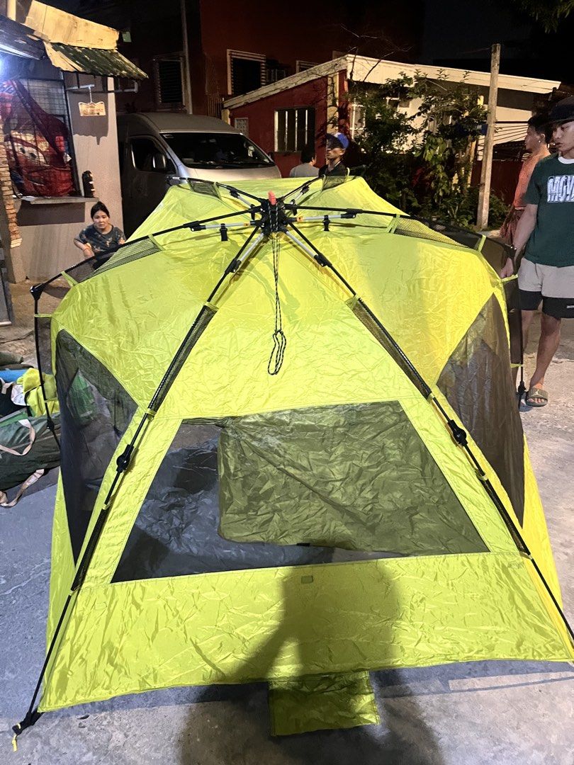QuickCamp Yellow Pop Up Outdoor Tent (Category: Hiking & Camping) located in Manila. Submitted by markhie22 (Listing ID 1467767928, Image 2). Description: - Features: Silver reflective flooring (keeps interior cool) and mesh windows for ventilation - Condition: , very clean - Inclusions: Matching carry bag - Ideal for: Camping trips and beach days.