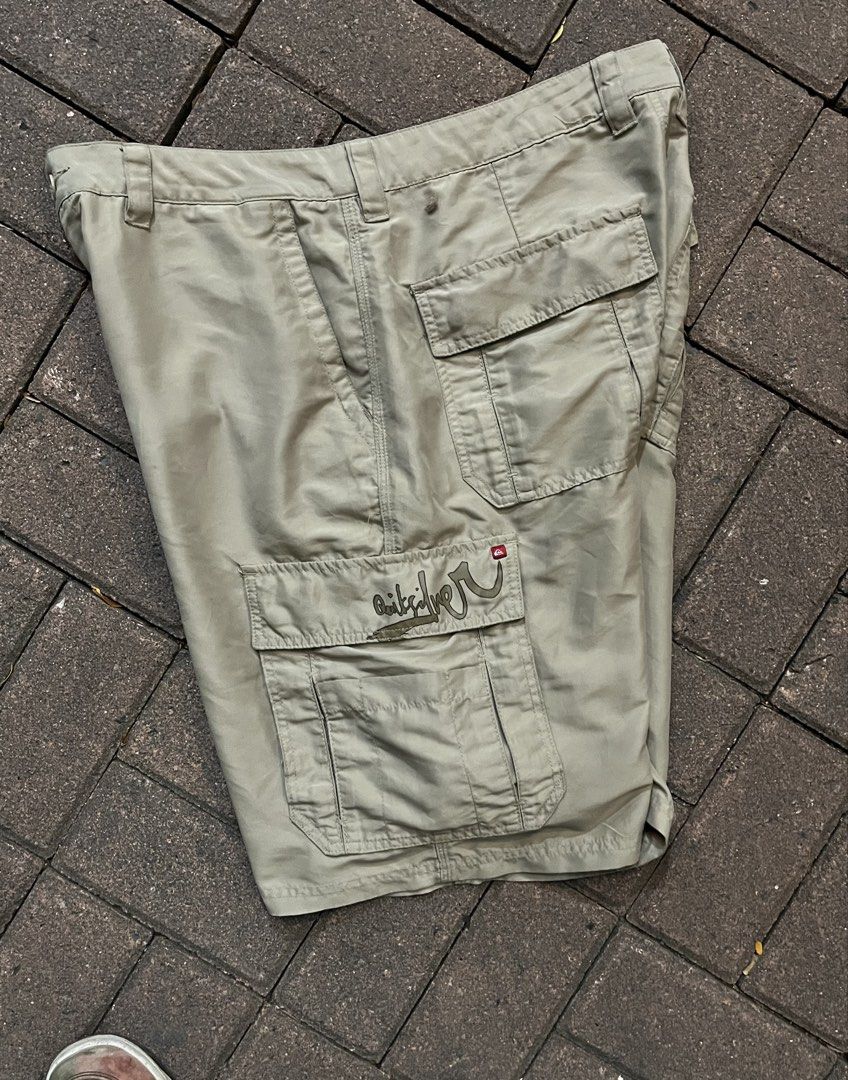 Quiksilver Khaki Cargo Shorts With Patterned Lining (Category: Shorts) located in Manila. Submitted by rusell_inmotion (Listing ID 1467825098, Image 2). Description: - Brand: Quiksilver - Color: Khaki - Style: Cargo shorts with multiple side utility pockets and embroidery branding - Design: Cool graphic pattern lining inside the waistband and pockets - Details: Button closure with belt loops - Condition: Ready to wear, solid everyday wear.
