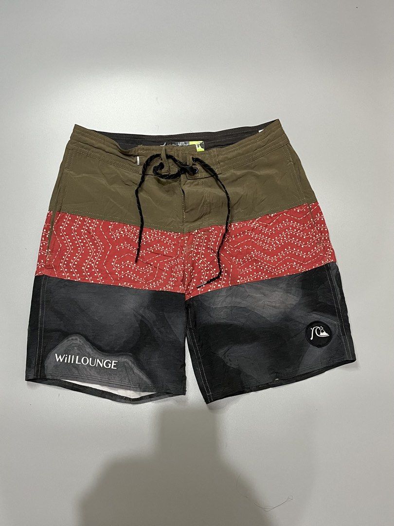Quiksilver x Will Lounge Board Shorts Multi-color (Category: Swim Trunks & Board Shorts) located in Manila. Submitted by jorgemabelin2001 (Listing ID 1467760376, Image 1). Description: - Brand: Quiksilver x Will Lounge collaboration - Design: Tri-color blocked (olive green top, red patterned middle, dark grey bottom) - Details: Back pocket with Quiksilver logo patch and matching Will Lounge hem print - Waist: Adjustable drawstring with black lace