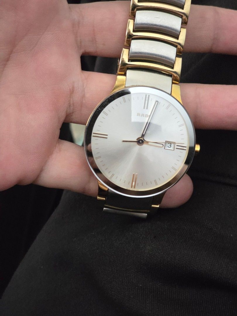 Rado Centrix two-tone (Category: Luxury Watches) located in Pasay City. Submitted by raf020 (Listing ID 1467668316, Image 1). Description: Selling my Rado Centrix with an elegant silver dial, two-tone gold and silver bracelet, and date display. Reference marking: 115.0931.3 Condition: Used, with visible scratches from normal wear Working condition: Working properly Inclusions: Watch only (no box or papers) Water resistance marking: 3 bar / 30 m P