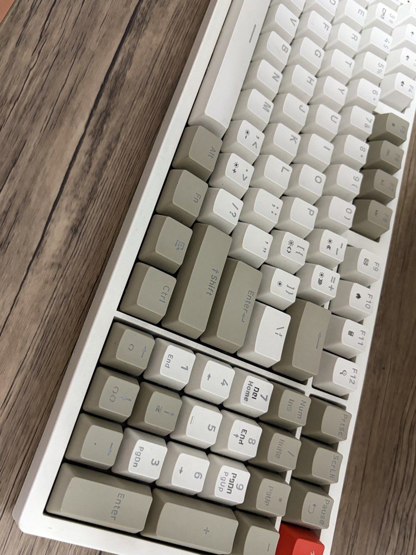 RAKK Ilis-C Mechanical Keyboard Beige White (Category: Computer Keyboard) located in Quezon City. Submitted by cymij (Listing ID 1467796725, Image 2). Description: - Model: Rakk Ilis-C Mechanical Keyboard - Colorway: Stylish beige and white with a striking orange accent key - Layout: Compact design complete with a numeric keypad - Connectivity: Wired via detachable Type-C cable - Extra Features: Dedicated multimedia keys for easy control - Build: