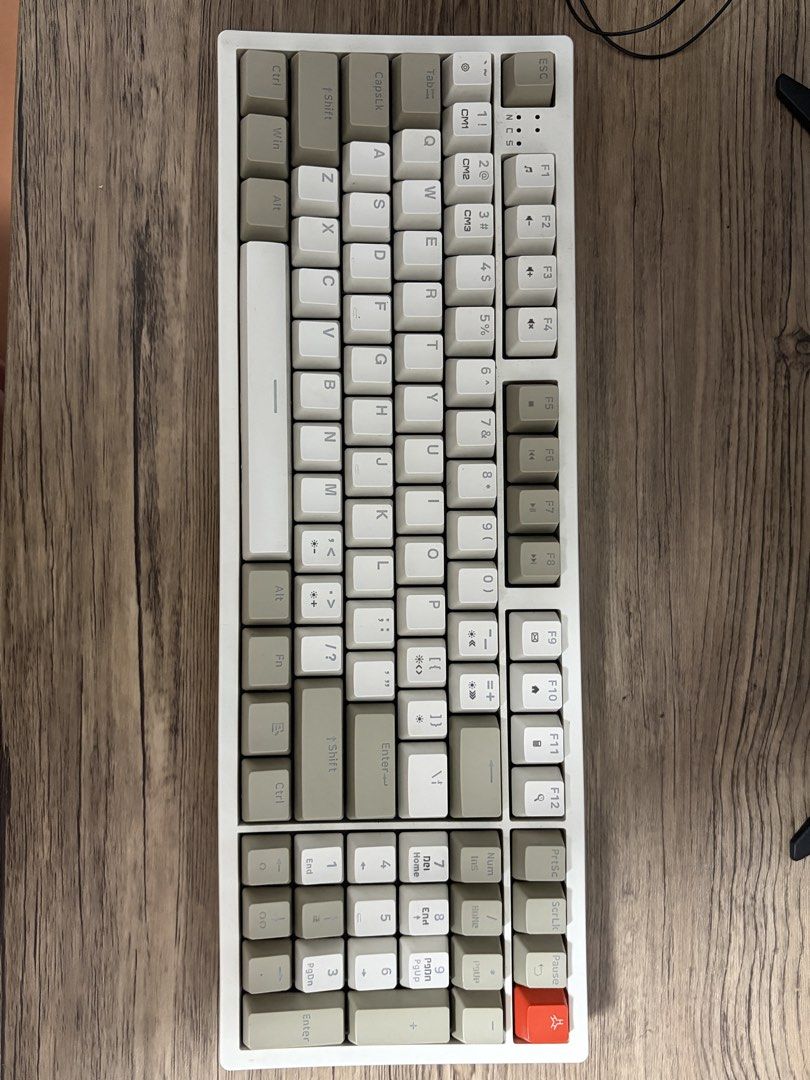 RAKK Ilis-C Mechanical Keyboard Beige White (Category: Computer Keyboard) located in Quezon City. Submitted by cymij (Listing ID 1467796725, Image 1). Description: - Model: Rakk Ilis-C Mechanical Keyboard - Colorway: Stylish beige and white with a striking orange accent key - Layout: Compact design complete with a numeric keypad - Connectivity: Wired via detachable Type-C cable - Extra Features: Dedicated multimedia keys for easy control - Build: