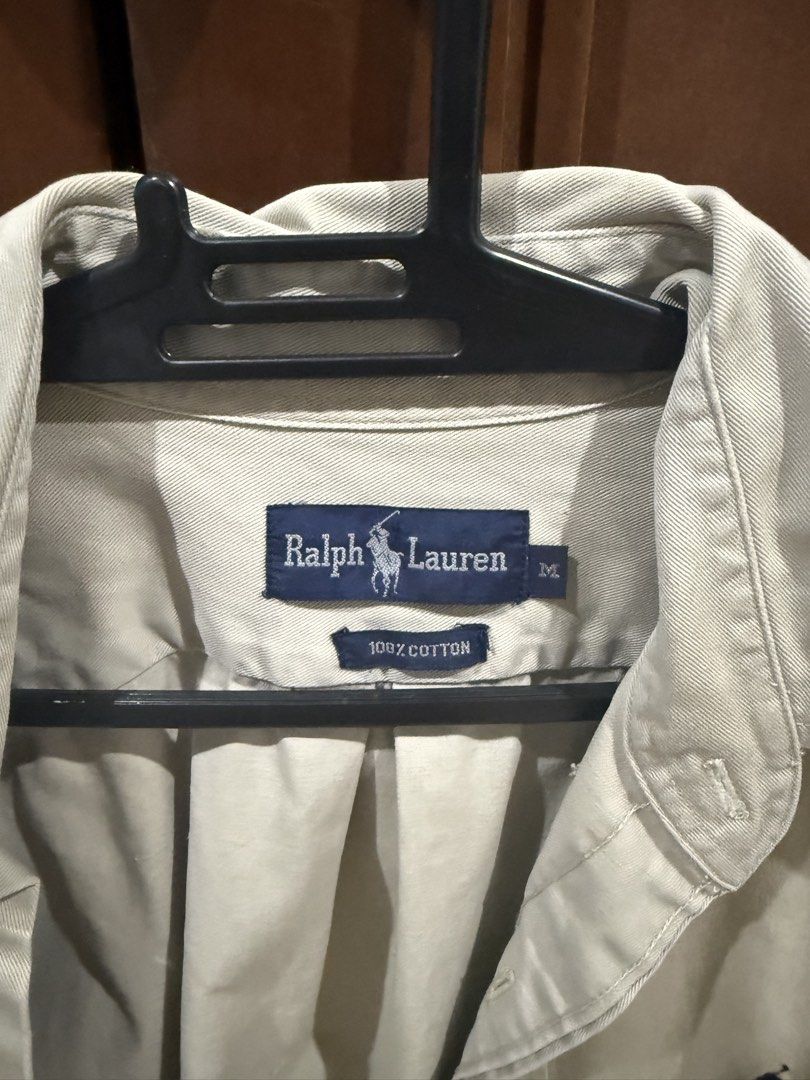 Ralph Lauren Button Down Shirt Beige Size M (Category: Tshirts & Polo Shirts ) located in Manila. Submitted by p4t4kyv7dd43387 (Listing ID 1467612543, Image 2). Description: - Brand: Ralph Lauren - Color: Classic beige - Size: Medium (M) - Material: 100% breathable cotton - Features: Long sleeves, standard collar, signature embroidered pony logo - Style: Versatile for casual outings or smart-casual looks - Condition: Excellent.