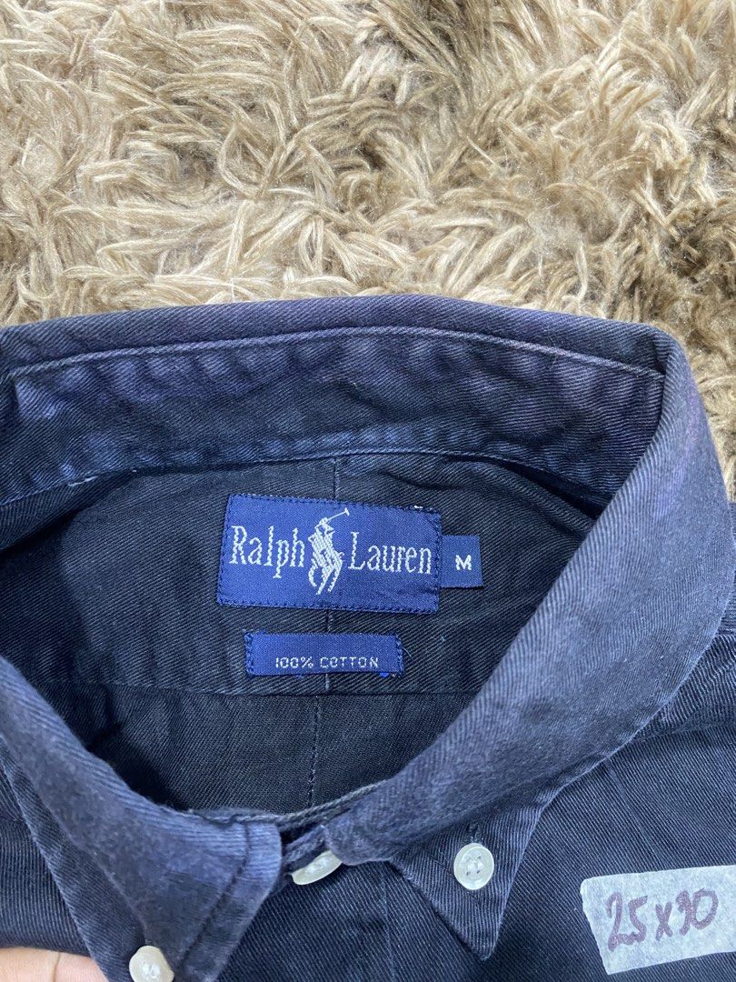 Ralph Lauren Button Down Shirt Navy Size M (Category: Tshirts & Polo Shirts ) located in Cagayan de Oro. Submitted by sepamorash53558 (Listing ID 1467642437, Image 3). Description: - Brand: Ralph Lauren - Style: Long sleeve button-down shirt with classic collar and front button closure - Color: Navy blue with red embroidered pony logo on the chest - Material: 100% cotton - Size: Medium (Tag attached) - Measurements: 25" x 30" - Condition: Shows n