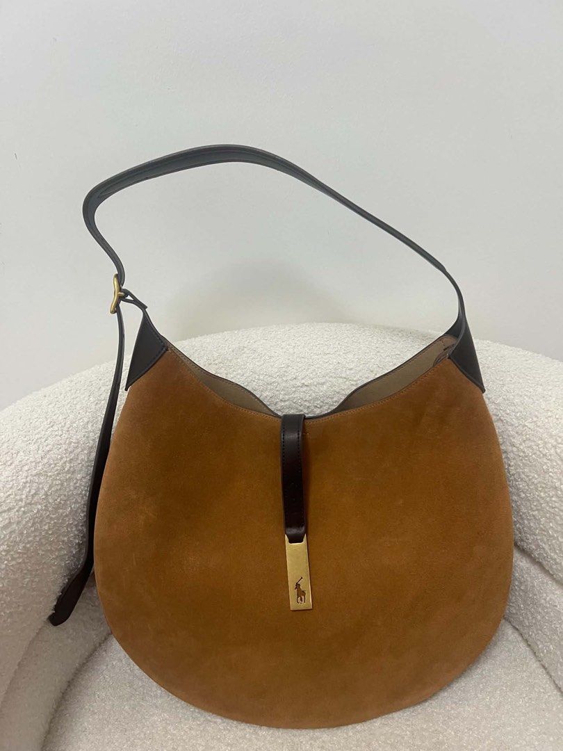 Ralph Lauren Polo Bag (Category: Luxury Bags & Wallets) located in Abulug. Submitted by jamiecammie (Listing ID 1467615824, Image 1). Description: - Brand: Polo Ralph Lauren - Material: Rich brown suede with dark leather trim - Hardware: Gold-tone with engraved rider logo front plaque - Strap: Adjustable for comfortable shoulder wear - Interior: Clean and spacious for daily essentials - Design: Structured base with classic equestrian style.
