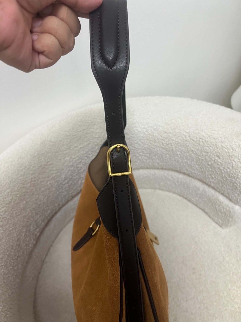 Ralph Lauren Polo Bag (Category: Luxury Bags & Wallets) located in Abulug. Submitted by jamiecammie (Listing ID 1467615824, Image 2). Description: - Brand: Polo Ralph Lauren - Material: Rich brown suede with dark leather trim - Hardware: Gold-tone with engraved rider logo front plaque - Strap: Adjustable for comfortable shoulder wear - Interior: Clean and spacious for daily essentials - Design: Structured base with classic equestrian style.