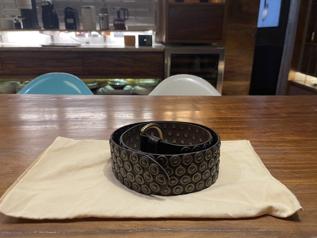 Ralph Lauren Studded Leather Belt (Category: Belts) located in Quezon City. Submitted by vaugncruz08 (Listing ID 1467589224, Image 3). Description: - Color: Dark brown leather - Details: Multiple rows of round brass-toned studs with dark metal grommets - Hardware: Heavy buckle design and substantial hardware - Condition: Brand new, tag attached, never worn - Negotiable.