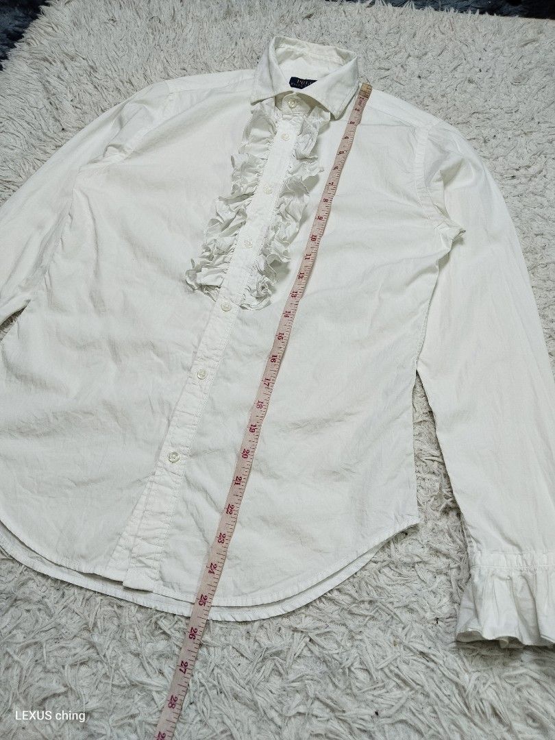 Ralph Lauren womens ruffled button down Size 2 on tag. (Category: Sleeveless) located in Manila. Submitted by lexusthrift1995 (Listing ID 1467787562, Image 3). Description: Size- 2 on tag but fit to SMALL Dimension- 17x25.5 Color rate- 9/10 Condition- 9/10 issue- no issue but need wash good condition ‼️300.pesos plus shipping fee 💸MODE OF PAYMENT- GCASH payment first 🚛MODE OF DELIVERY- J&T or LALAMOVE 📍LOCATION- NORTH CALOOCAN CAMARIN BRGY.177