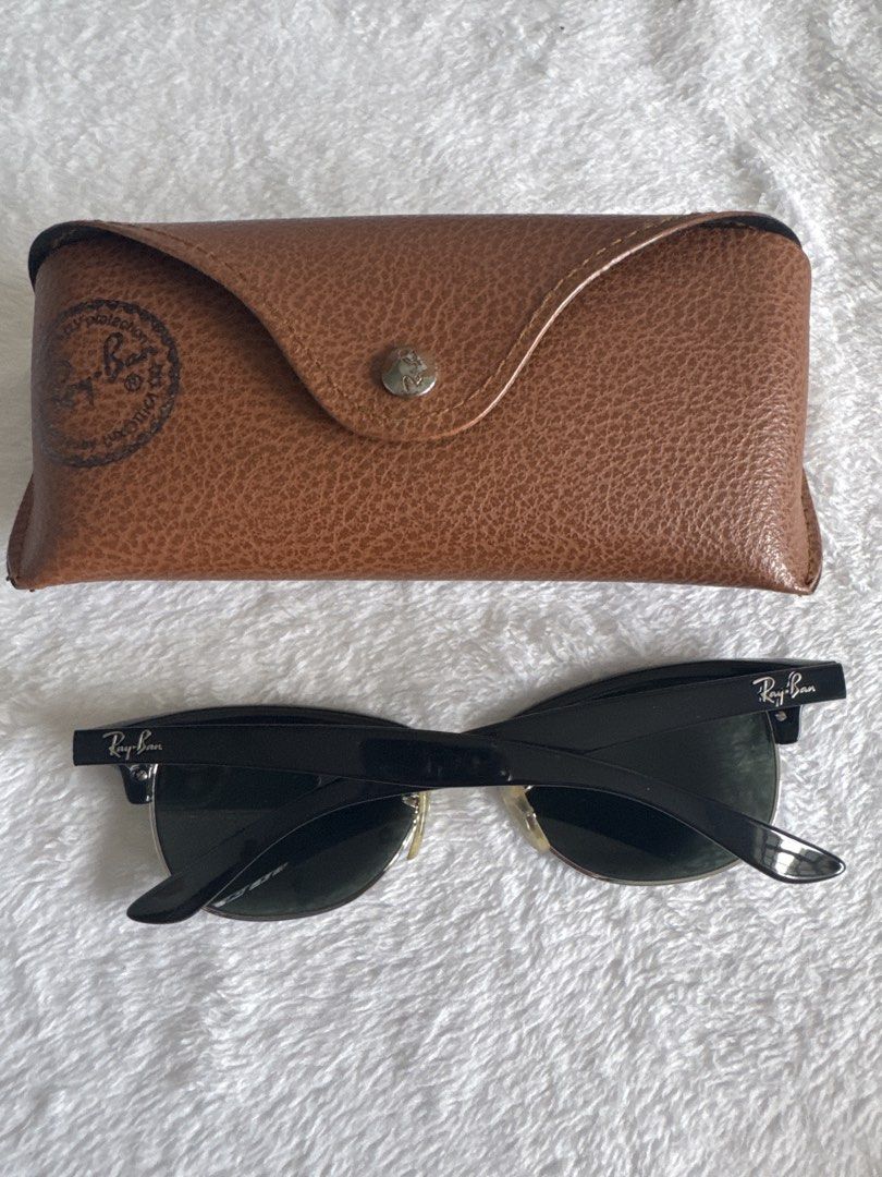 Ray-Ban Clubmaster Sunglasses with Case (Category: Sunglasses & Eyewear) located in Legazpi City. Submitted by bellatorre (Listing ID 1467616391, Image 2). Description: - Brand: Ray-Ban Clubmaster - Frame: Classic black and silver - Lenses: Dark green with signature logo on the right lens - Style: Timeless retro look - Inclusion: Original tan leatherette carrying case with snap closure and branding stamp Will pass as brandnew. Used a few times. J