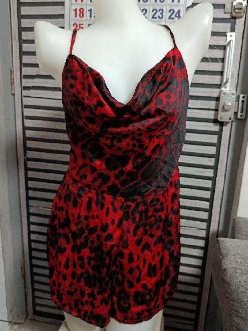 Red and black leopard print cowl neck romper (Category: Rompers) located in Quezon City. Submitted by robelles_thriftshop (Listing ID 1467776667, Image 1). Description: Red and black romper with an all-over leopard print pattern. Cowl neckline with spaghetti straps. Criss-cross back straps tie together at the lower back. Smooth satin-like fabric. Shorts style bottom..