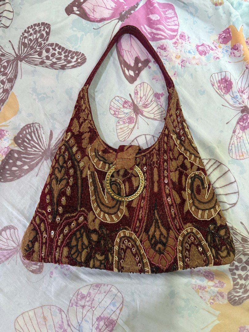Red and Gold Tapestry Beaded Shoulder Bag (Category: Shoulder Bags) located in Cebu City. Submitted by hotchkisscebu (Listing ID 1467675765, Image 2). Description: - Eye-catching red and gold tapestry fabric with intricate beading and sequins - Chic single shoulder strap design - Sparkling rhinestone-studded ring clasp on the front flap - Convenient exterior zipper pocket on the back - Unique vintage look, perfect statement accessory for any outi