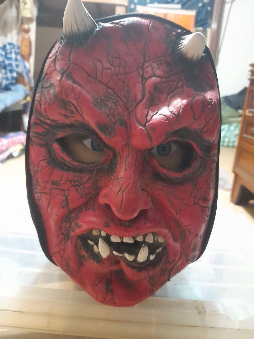 Red Devil Demon Mask with Horns and Black Hood (Category: Coats, Jackets and Outerwear) located in Bocaue. Submitted by marajapansurplus (Listing ID 1467716534, Image 1). Description: Red devil mask, textured cracked skin effect all over. White horns on top and pointy teeth around the mouth. Attached black fabric hood covers the head and back. Great for Halloween parties or costume events..