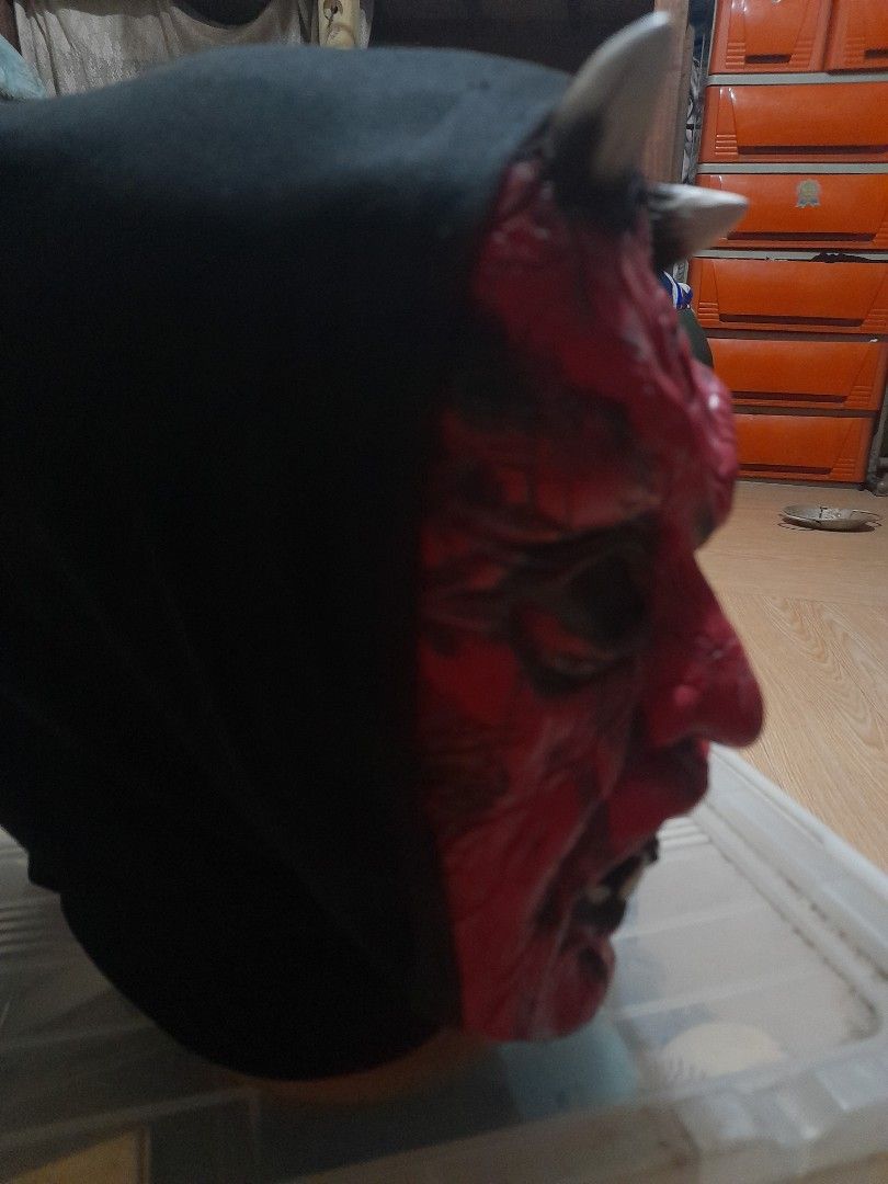 Red Devil Demon Mask with Horns and Black Hood (Category: Coats, Jackets and Outerwear) located in Bocaue. Submitted by marajapansurplus (Listing ID 1467716534, Image 3). Description: Red devil mask, textured cracked skin effect all over. White horns on top and pointy teeth around the mouth. Attached black fabric hood covers the head and back. Great for Halloween parties or costume events..