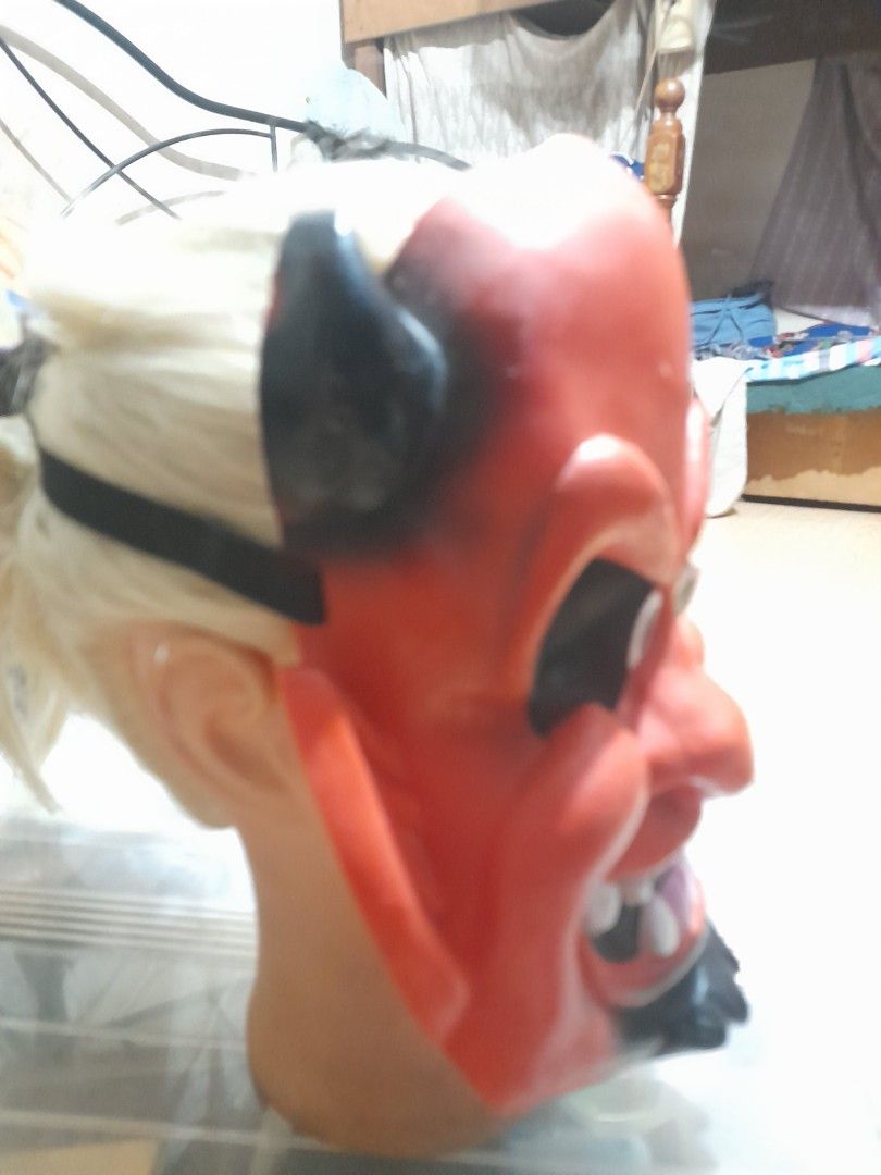 Red Devil Halloween Mask with Black Horns and Elastic Strap (Category: Occasions & Party Supplies) located in Bocaue. Submitted by marajapansurplus (Listing ID 1467717241, Image 2). Description: - Material: Durable, lightweight plastic - Design: Molded horns, pointed ears, and detailed teeth - Comfort & Safety: Mesh eye cutouts for clear visibility - Fit: Attached black elastic band for a secure fit - Perfect for: Halloween parties and trick-or-t