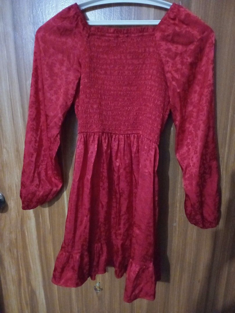 Red long sleeve smocked mini dress (Category: Babies & Kids Fashion) located in Marikina City. Submitted by joyful.finds (Listing ID 1467666280, Image 2). Description: - Color: Bright red - Neckline: Square neckline - Sleeves: Long sleeves - Bodice: Stretchy smocked design for a comfortable fit - Hem: Flouncy ruffle hem - Fabric: Lightweight with a subtle woven jacquard pattern - Best for: Casual outings, dates, and everyday wear.