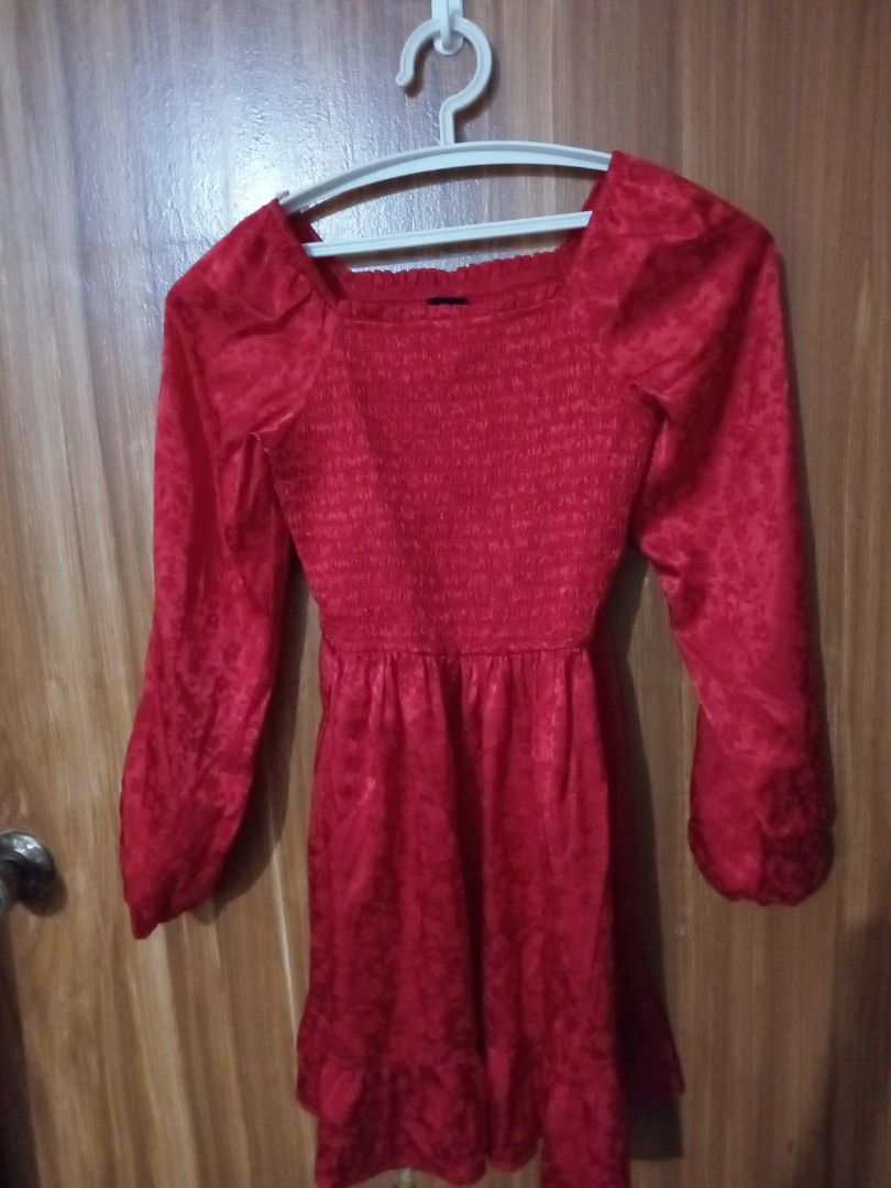 Red long sleeve smocked mini dress (Category: Babies & Kids Fashion) located in Marikina City. Submitted by joyful.finds (Listing ID 1467666280, Image 1). Description: - Color: Bright red - Neckline: Square neckline - Sleeves: Long sleeves - Bodice: Stretchy smocked design for a comfortable fit - Hem: Flouncy ruffle hem - Fabric: Lightweight with a subtle woven jacquard pattern - Best for: Casual outings, dates, and everyday wear.