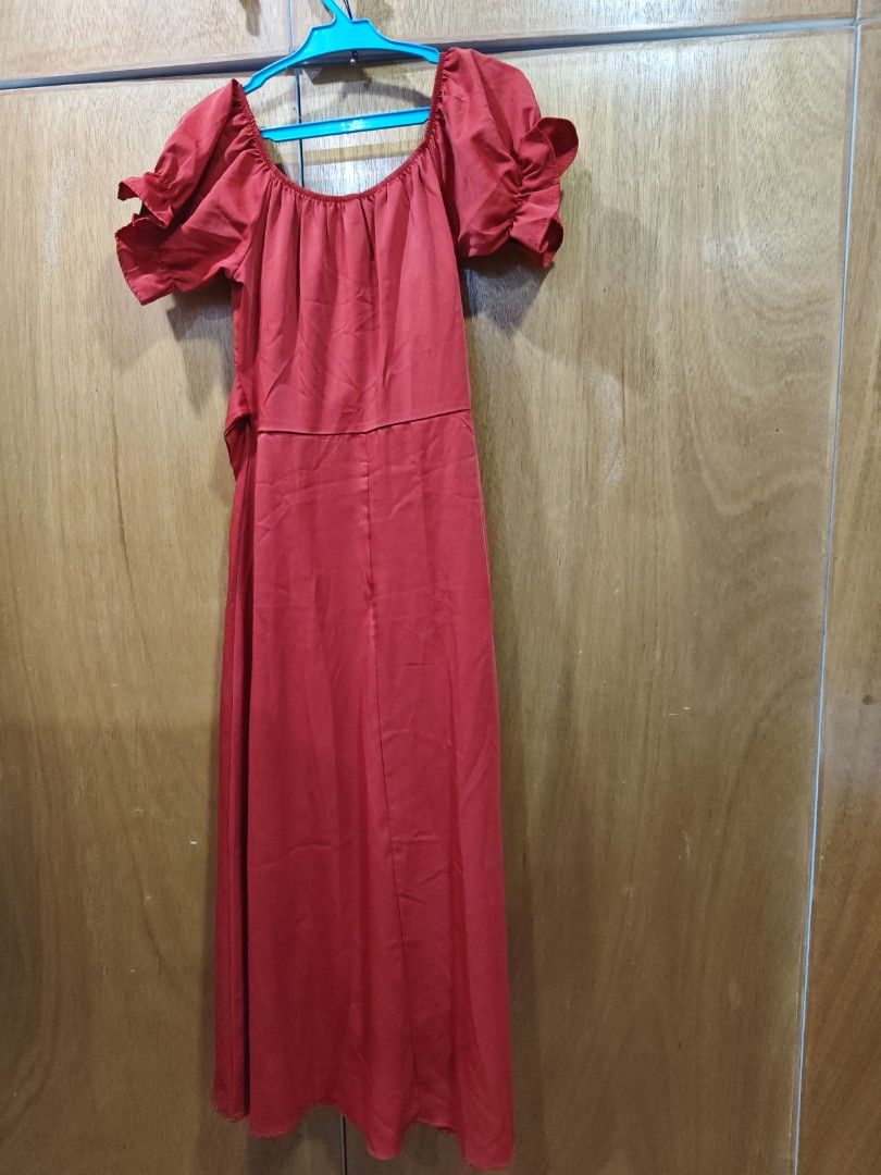 Red off shoulder midi dress (Category: Dresses) located in Caloocan City. Submitted by grandfish.db3ec8 (Listing ID 1467744189, Image 2). Description: - Color & Style: Vibrant red midi dress, casual and chic - Neckline: Off-shoulder with a comfy elastic band - Sleeves: Short ruffled sleeves - Fit: Fitted waist with a straight skirt - Condition: Clean fabric, no flaws noticed - Best for: Warm weather outings and casual dates.