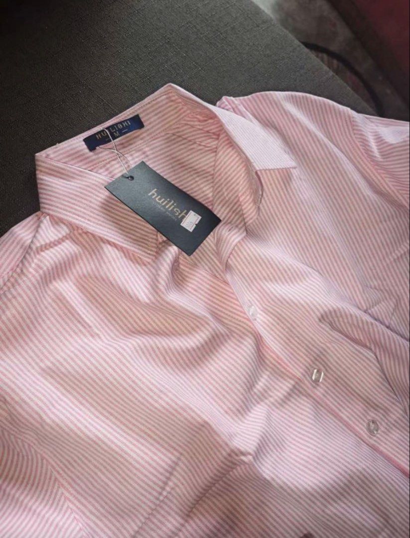 Red Pink Stripes Long Sleeves (Category: Tshirts & Polo Shirts ) located in San Juan City. Submitted by kassyjsn (Listing ID 1467784755, Image 2). Description: Red Pink Stripes Long Sleeves - Brand: Huilishi - Style: Pink & Red Striped Long Sleeves button-down shirt - Size: Medium (M) - Features: Classic collar, front button closure, soft and breathable fabric - Perfect for: Casual outings, smart-casual office wear, or daily OOTDs - Can be oversi